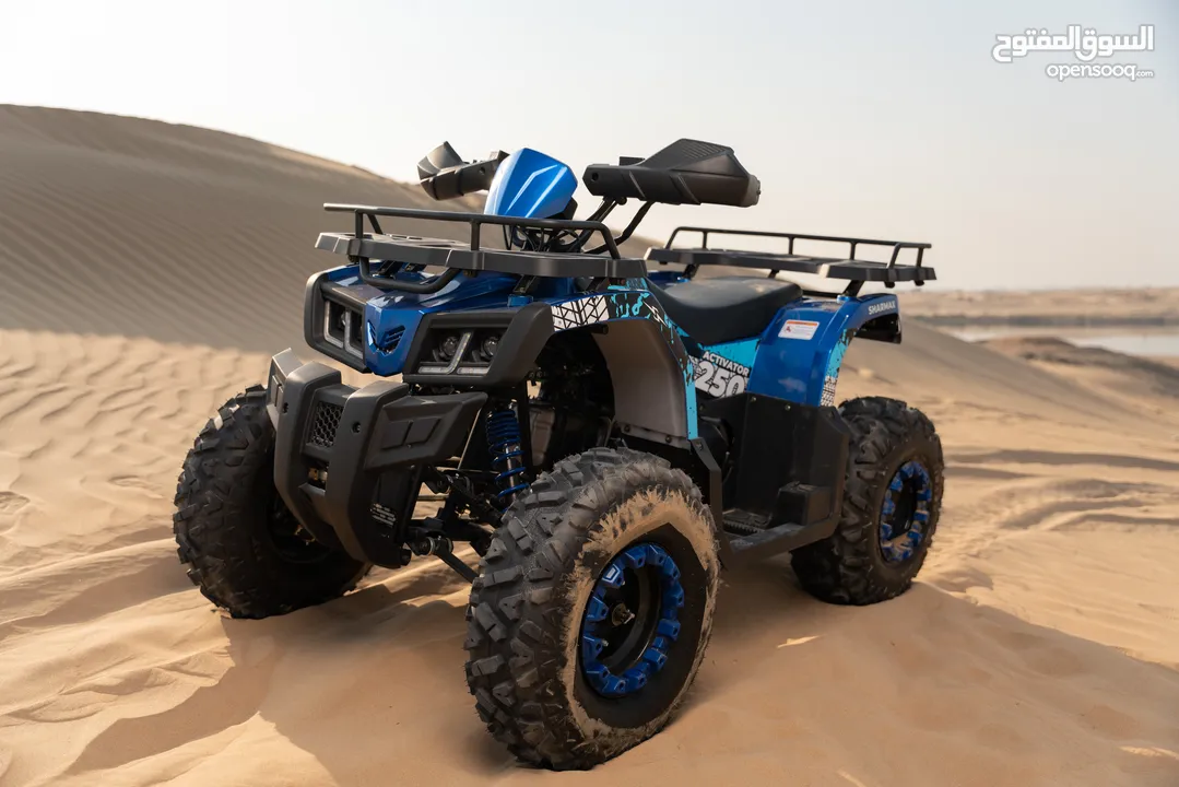 Quad bikes parked on red sand dunes in Dubai